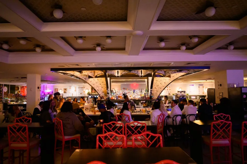 Evening crowd at the Mia Market bar during an event